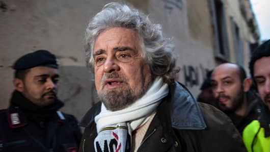 Beppe Grillo, founder of the Movimento 5 Stelle (Five Star Movement), arrives to speak during a public rally for the political campaign on January 23, 2013 in Pomezia, Italy.